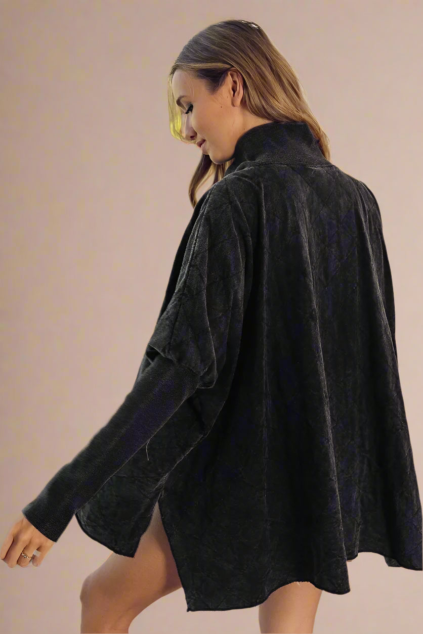 Woman wearing a black textured top