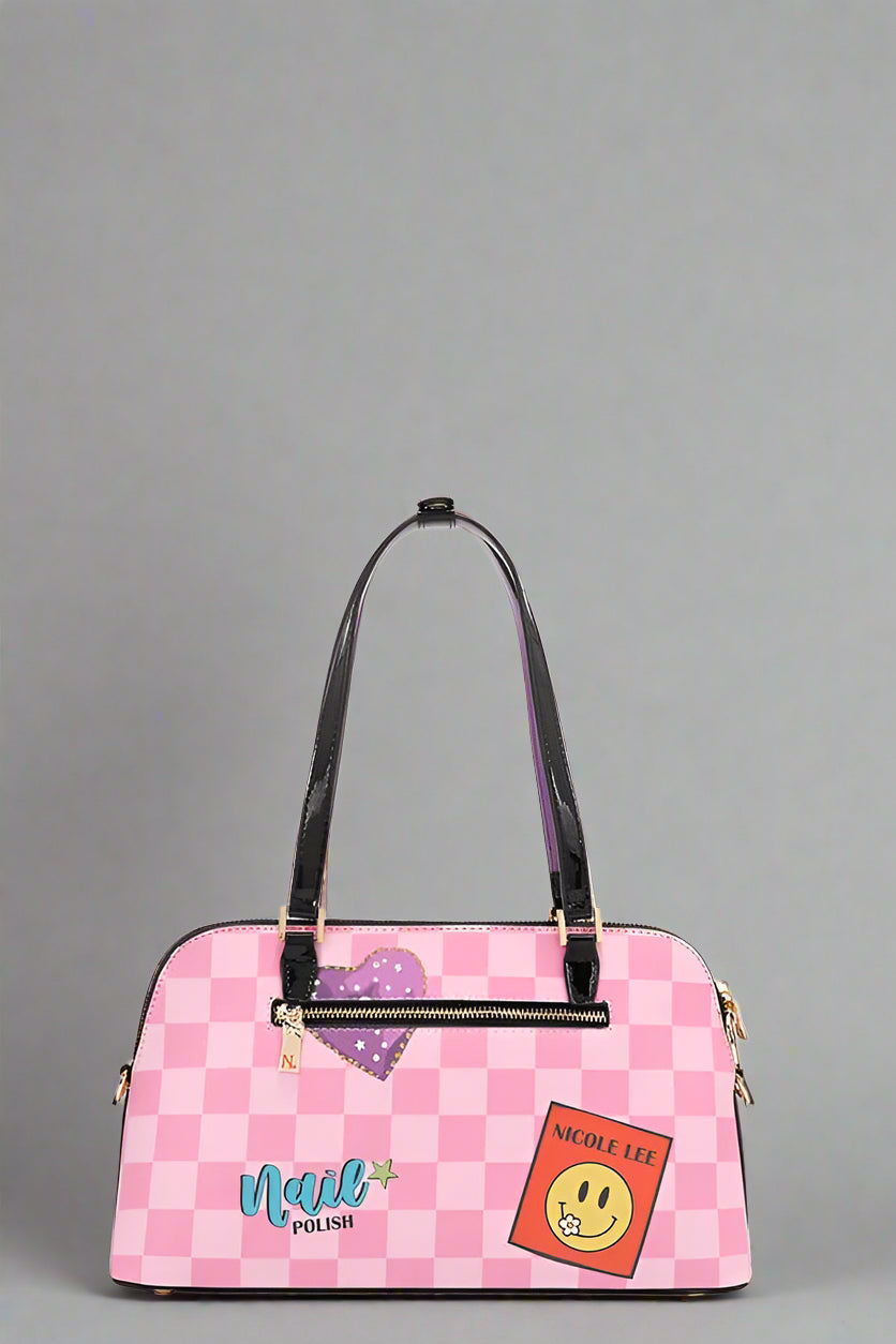 Pink checkered handbag with colorful patches on a white background