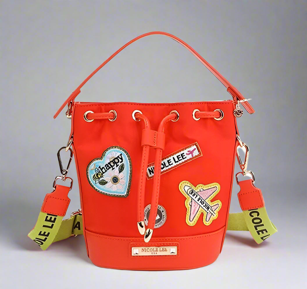 Red bucket bag with patches and drawstring on a white background