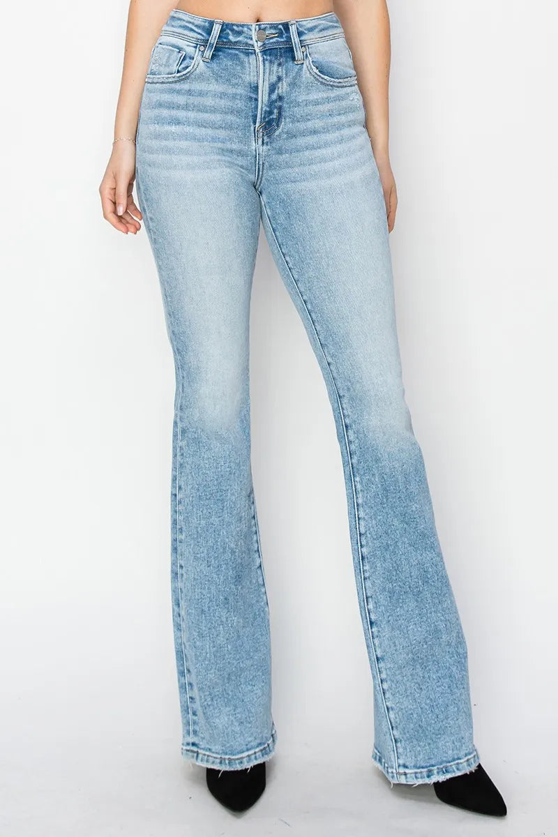 Light blue jeans worn by a person on a white background