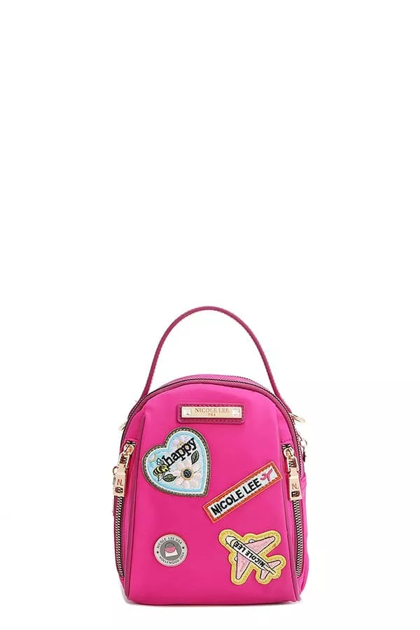 Pink backpack with patches on a white background