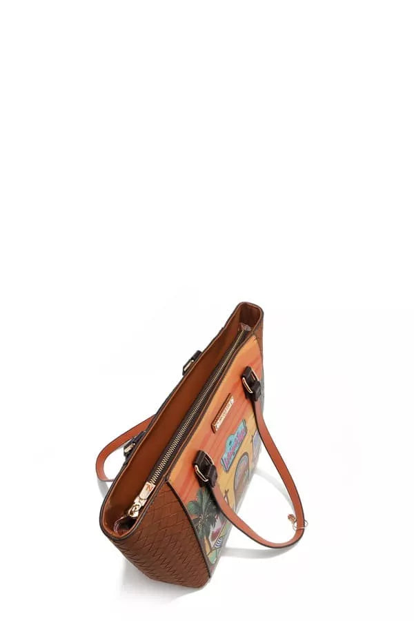 Brown leather handbag with floral pattern on a white background