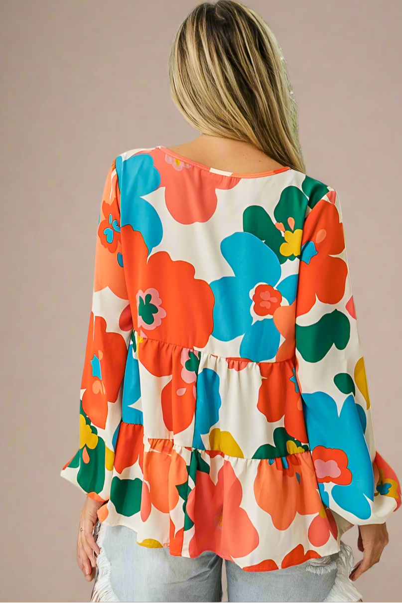 Woman wearing a colorful floral blouse