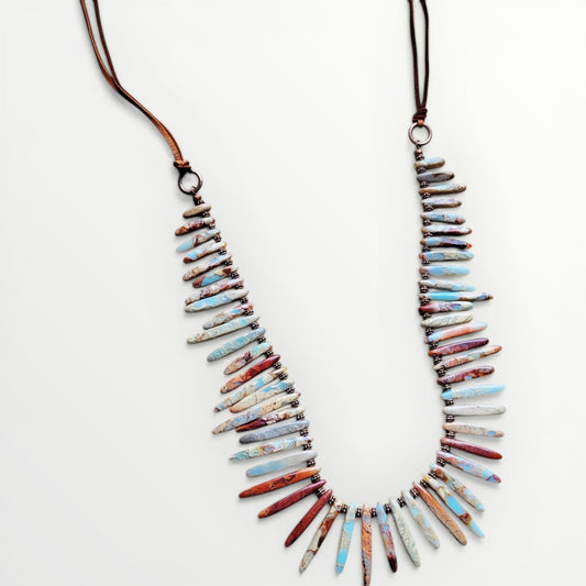 Necklace with multicolored beads on a white background