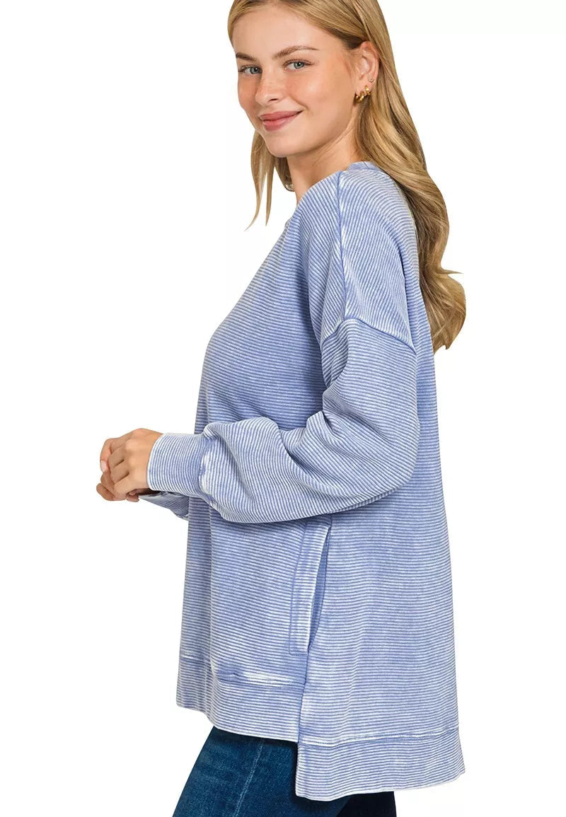 Woman wearing a blue and white striped shirt on a white background