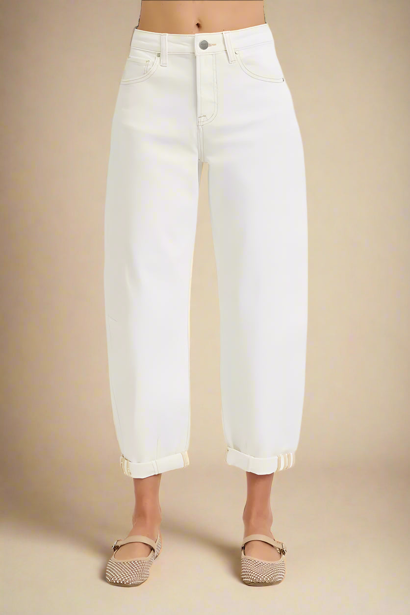 White jeans worn by a person on a white background