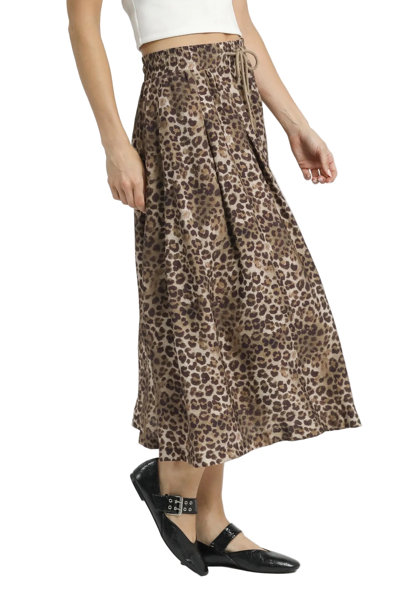 Leopard print skirt worn by a person on a white background