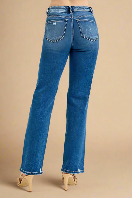 Blue jeans worn by a person on a white background