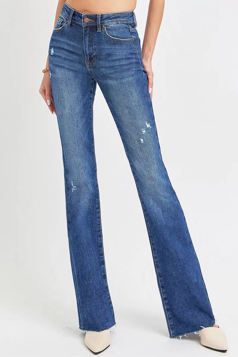 Blue jeans worn by a person on a white background