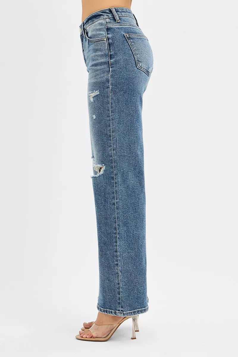 Blue jeans with a distressed look on a white background
