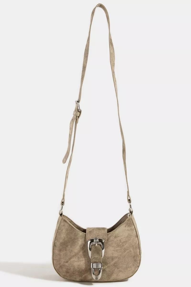 Beige handbag with a strap on a white background