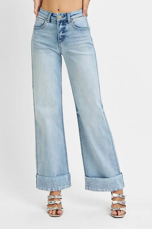 Light blue jeans worn by a person on a white background