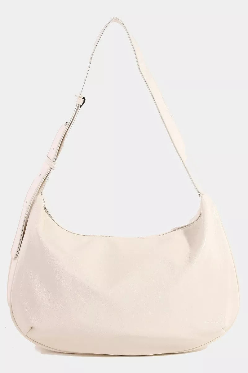 Beige handbag with a white interior on a light gray background