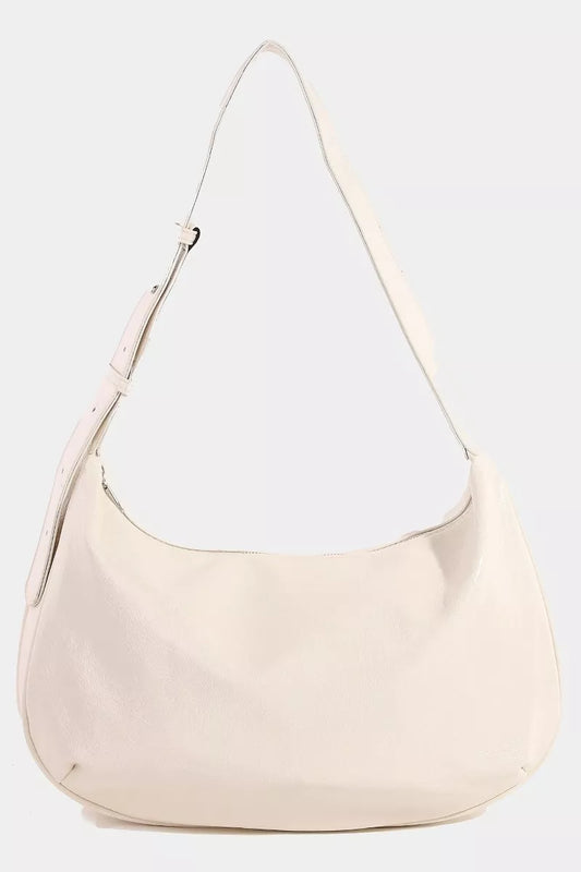 Beige handbag with a white interior on a light gray background