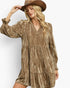 A woman wearing a bronze metallic-textured tiered dress with long sleeves and a matching brown cowboy hat, posing against a plain white studio background.