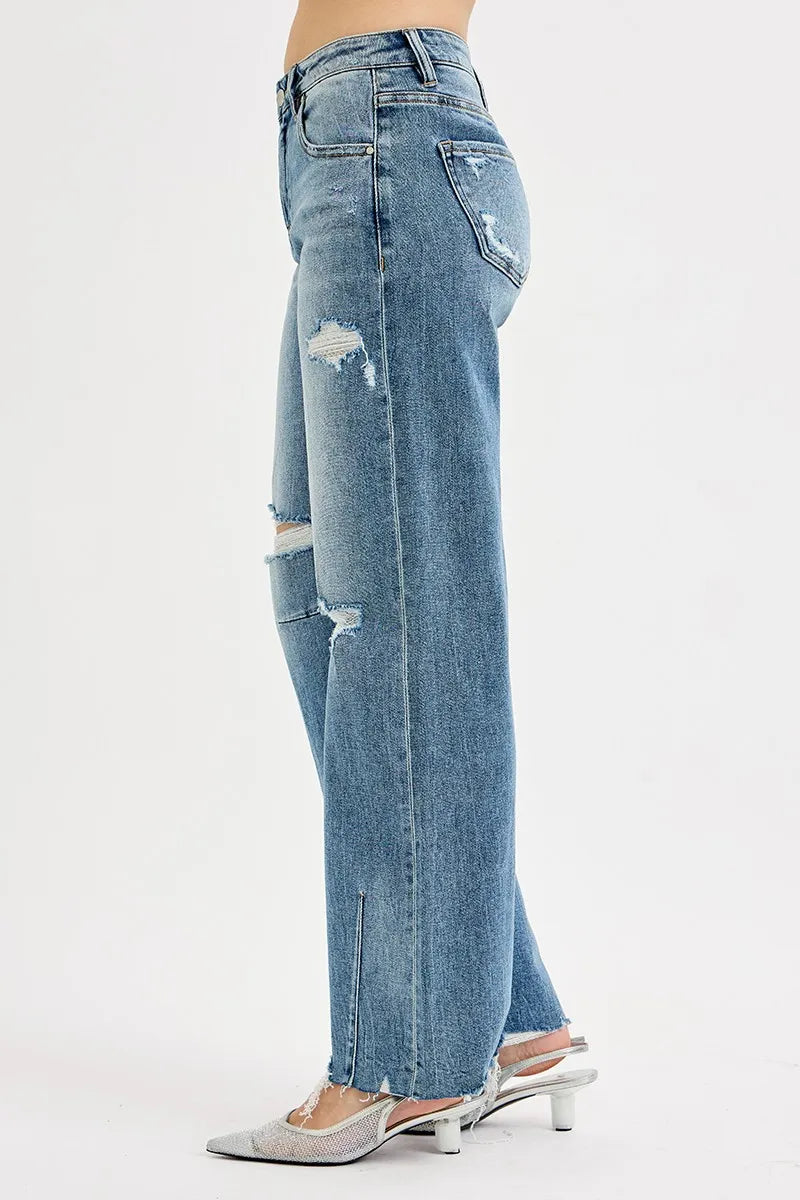 Blue jeans with a slight distressed look on a white background