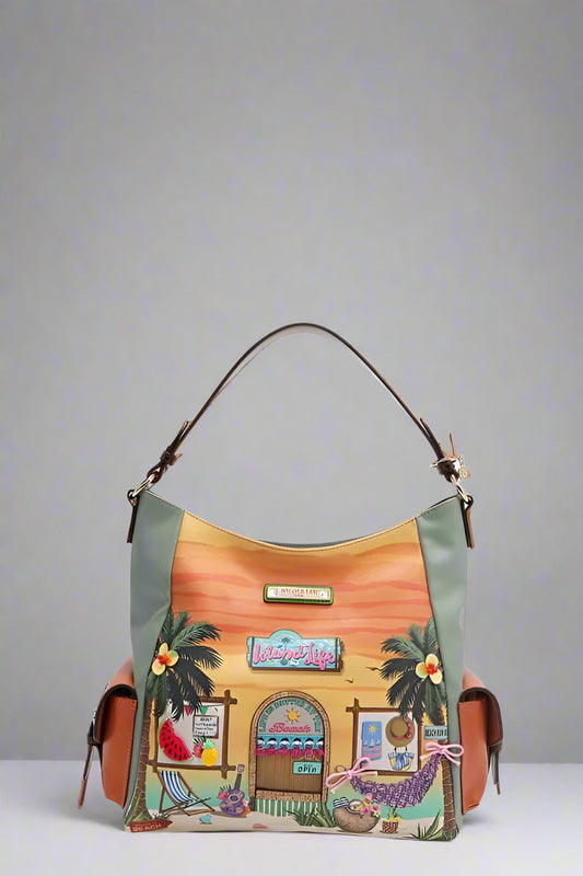 Colorful handbag with a tropical design featuring palm trees and a building on a white background.