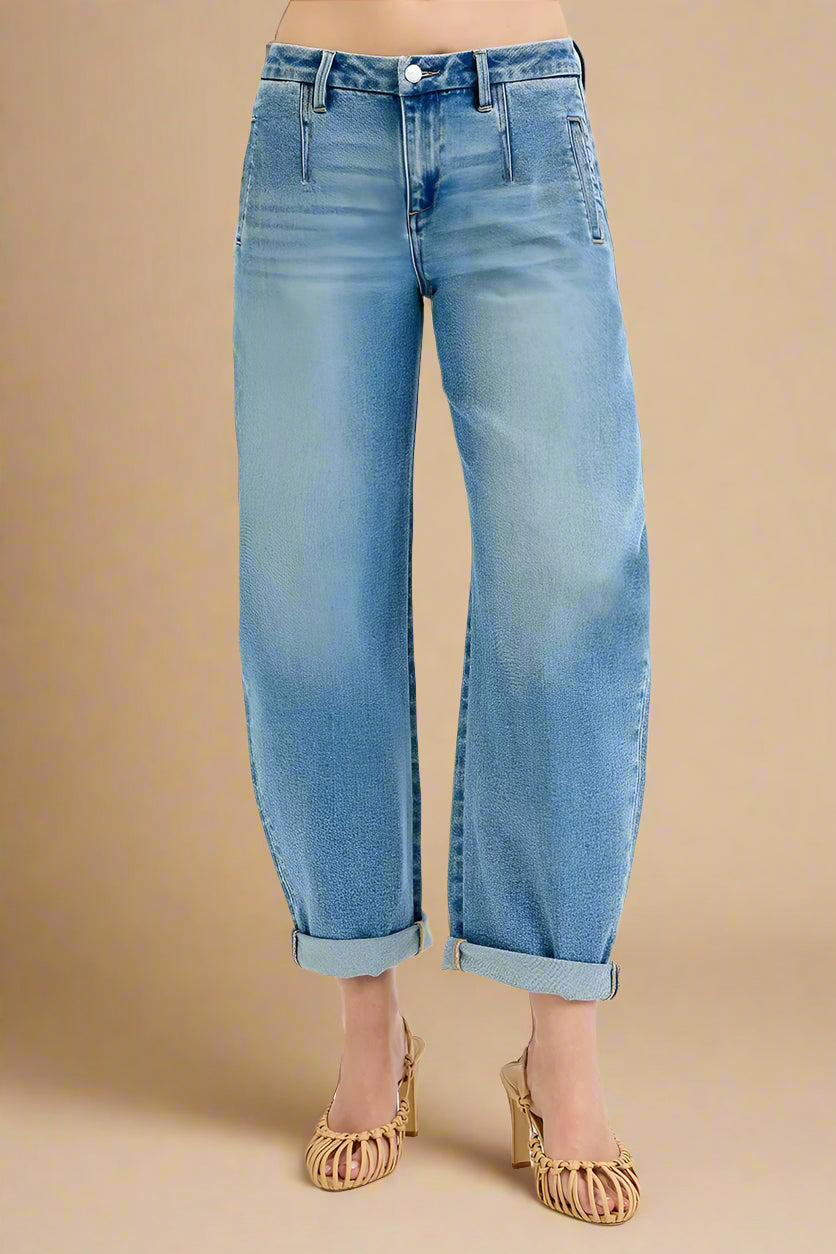 Light blue jeans worn by a person on a white background