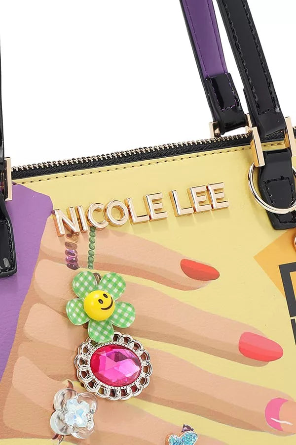 Colorful handbag with 'NICOLE LEE' branding held by a hand with red nail polish.