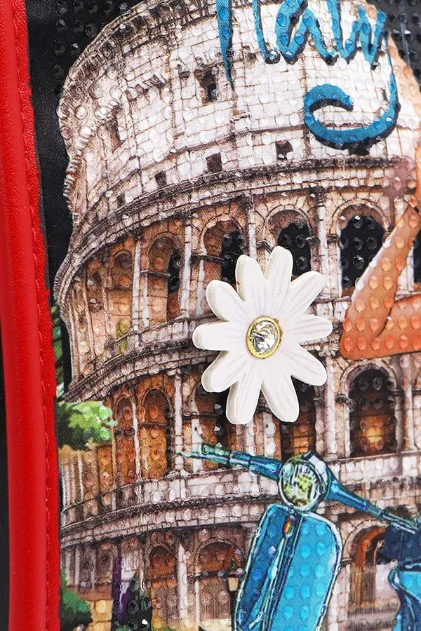 Decorative item with a building, flower, and scooter design on a red background