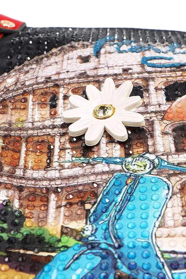 Decorative item with a white flower and blue accents on a mosaic background