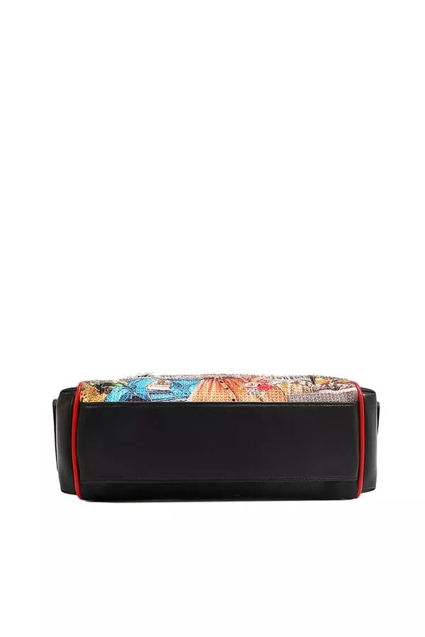 Black clutch with colorful patterned flap on a white background