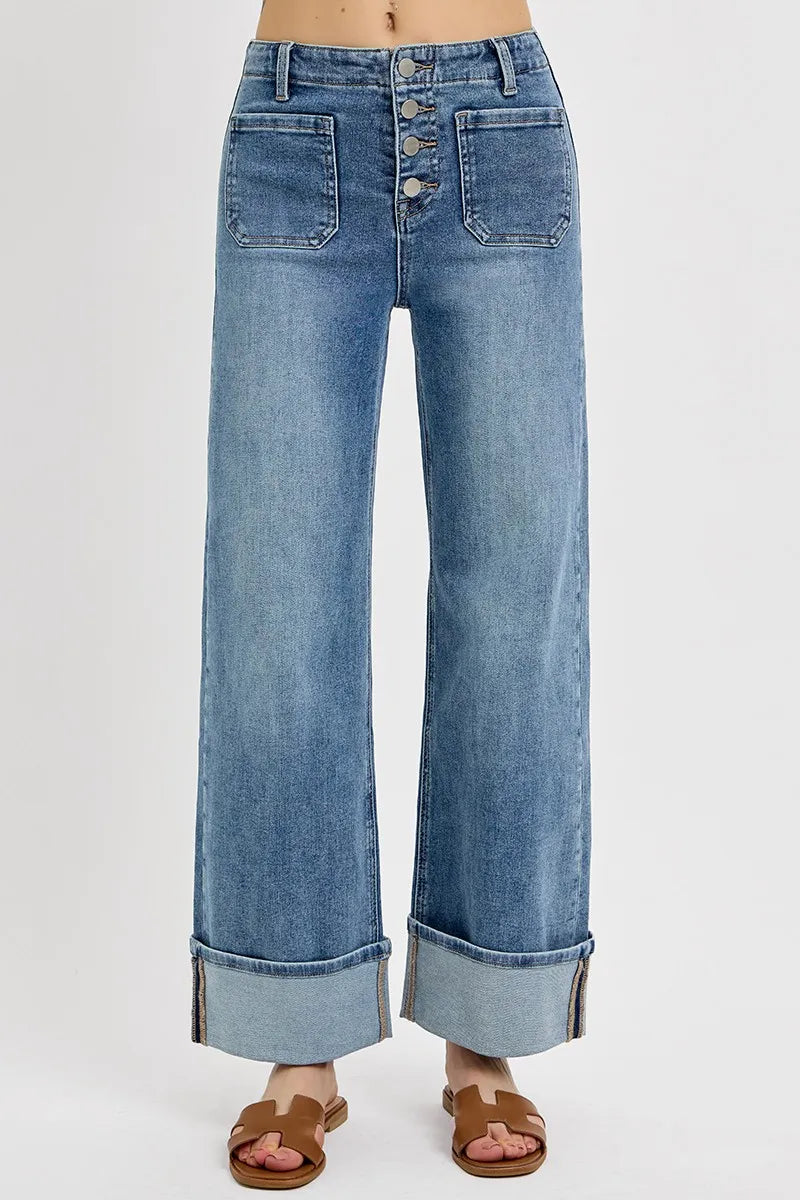 Wide-leg jeans with a button fly on a white background