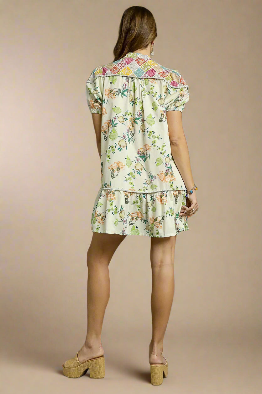 Woman wearing a floral dress on a beige background
