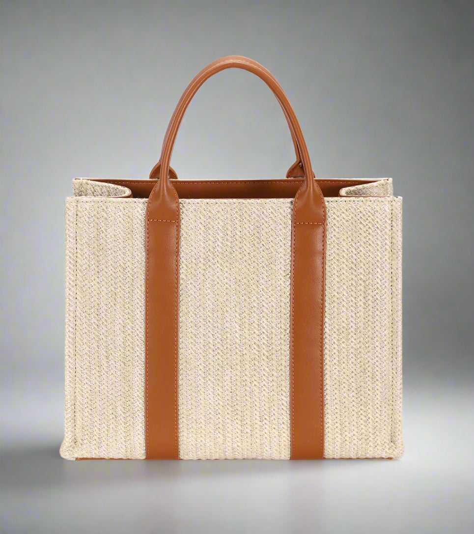 Tote bag with brown leather straps on a white background