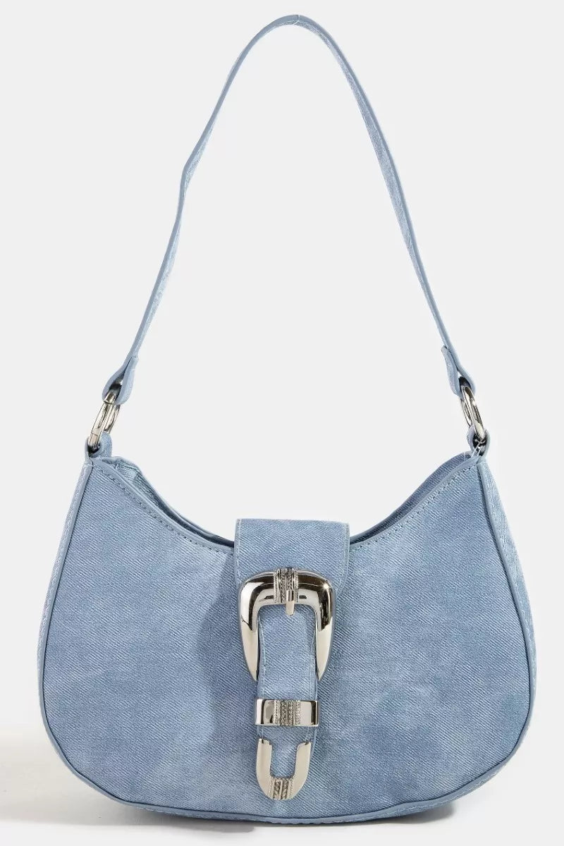 Blue handbag with a silver buckle on a white background