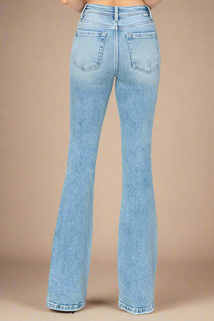 Light blue jeans on a beige background