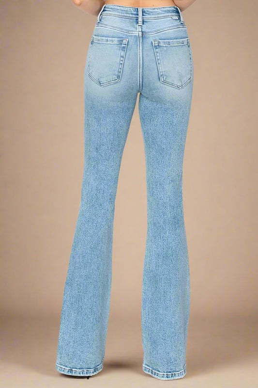 Light blue jeans on a beige background