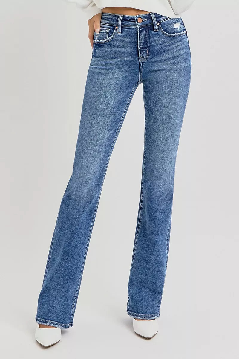 Blue jeans worn by a person on a white background