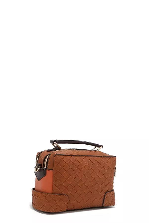 Brown quilted handbag with a black handle on a white background