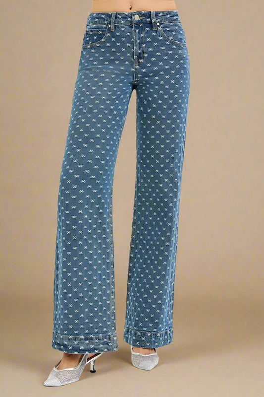 Blue patterned jeans on a beige background