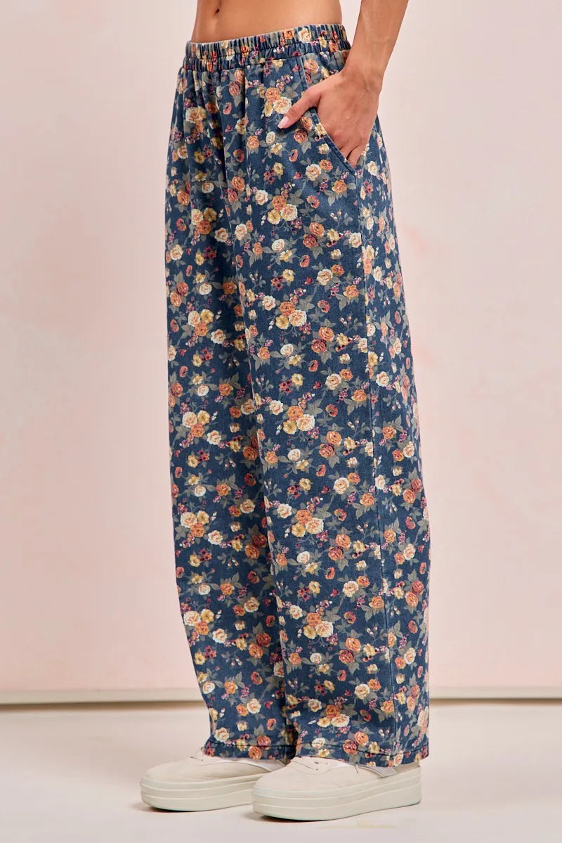 Floral-patterned pants worn by a person on a plain background