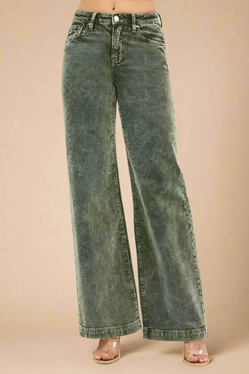 Green wide-leg jeans on a white background