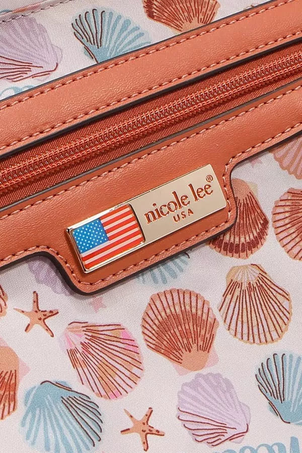 Close-up of a handbag with shell pattern and Nicole Lee logo