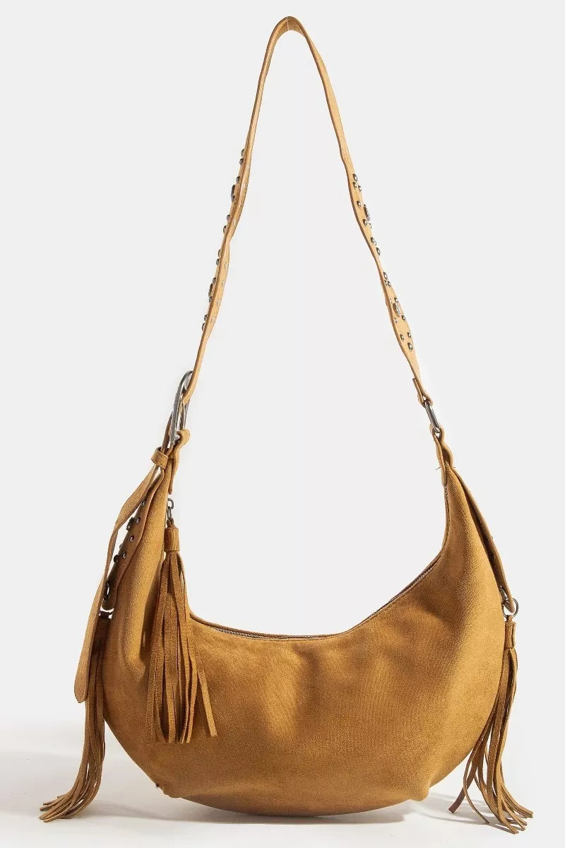 Brown suede handbag with fringes on a white background