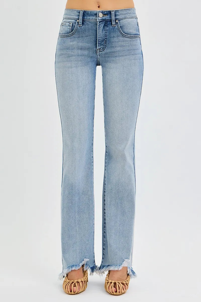 Light blue jeans with frayed hem on a white background