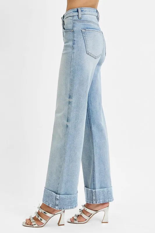 Light blue jeans worn by a person on a white background