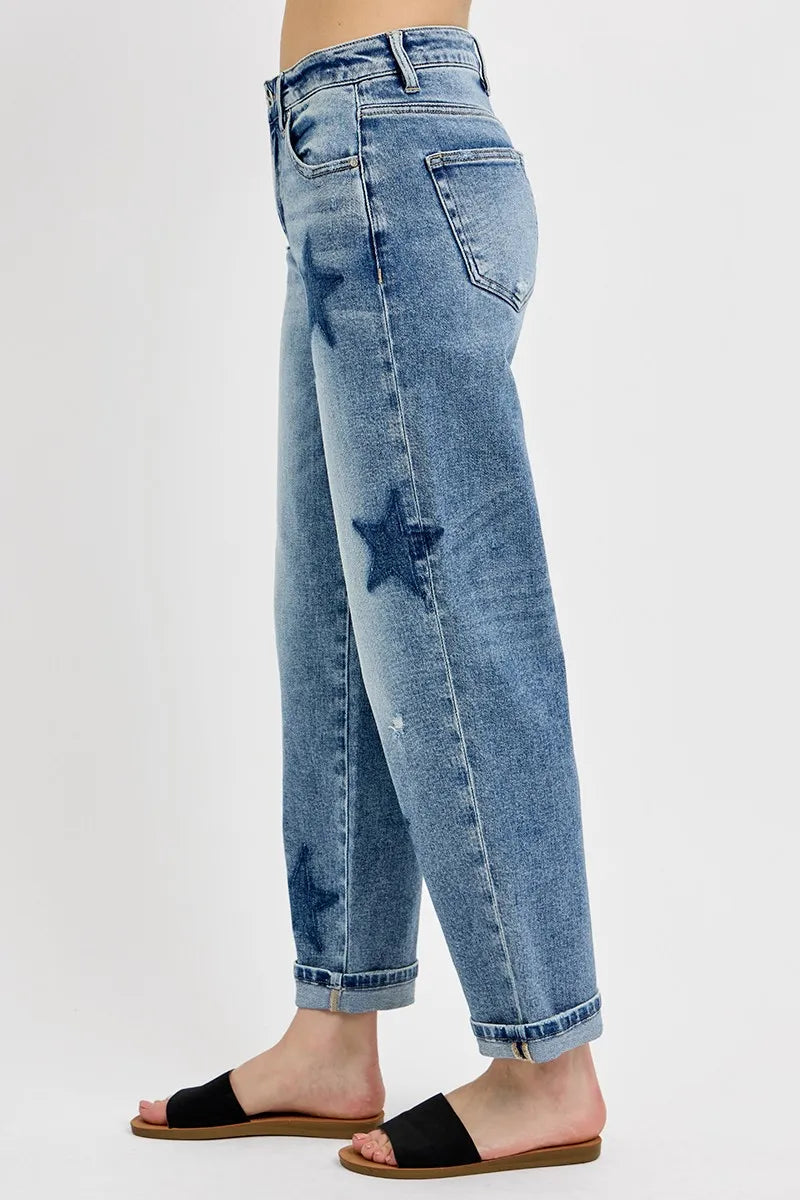 Light blue jeans with star patterns on a white background