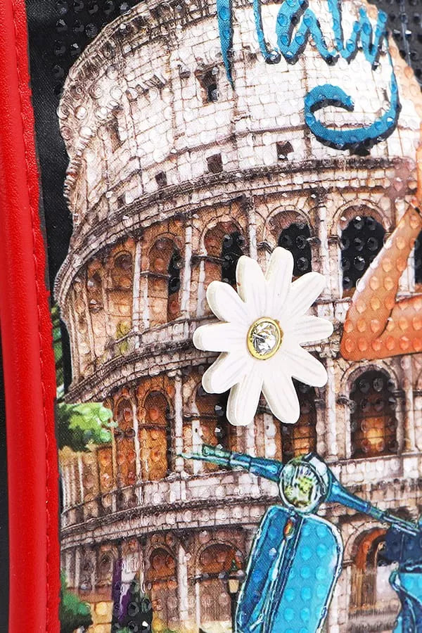 Decorative item with a building, flower, and scooter design on a red background