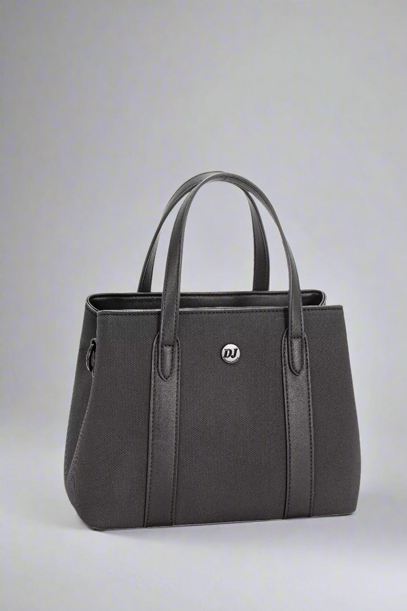 Black handbag with a visible brand logo on a light gray background