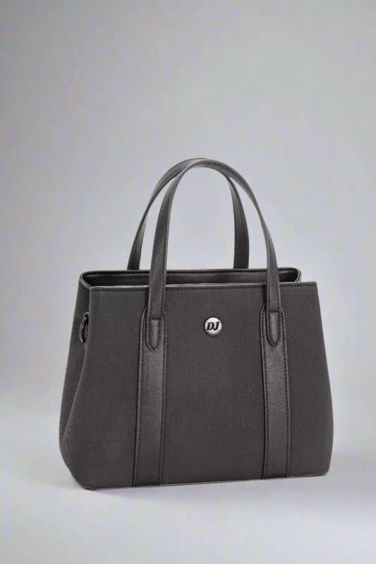 Black handbag with a visible brand logo on a light gray background
