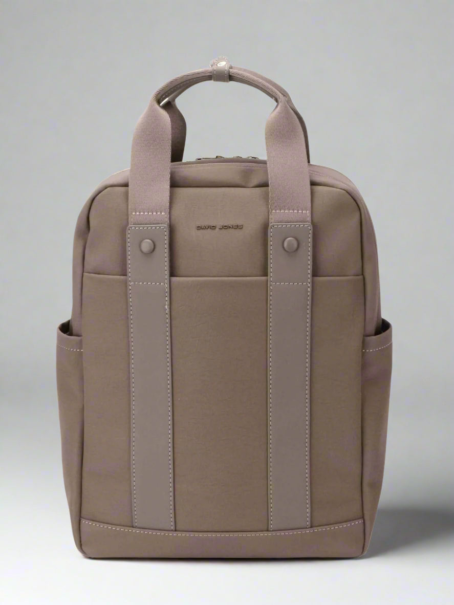 Brown backpack with straps on a white background