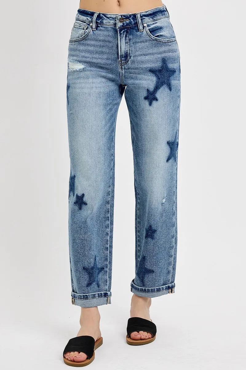 Blue jeans with star patterns on a white background