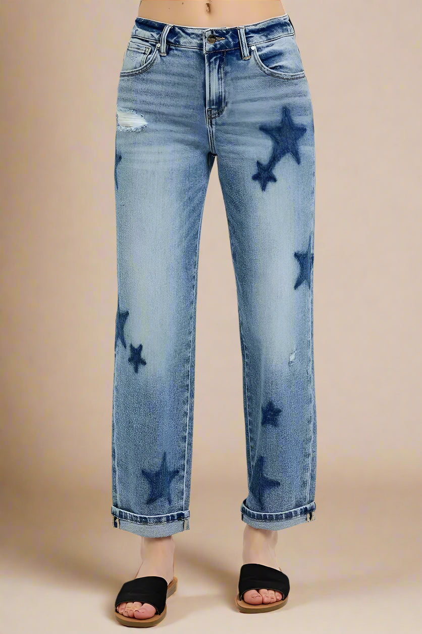 Blue jeans with star patterns on a white background