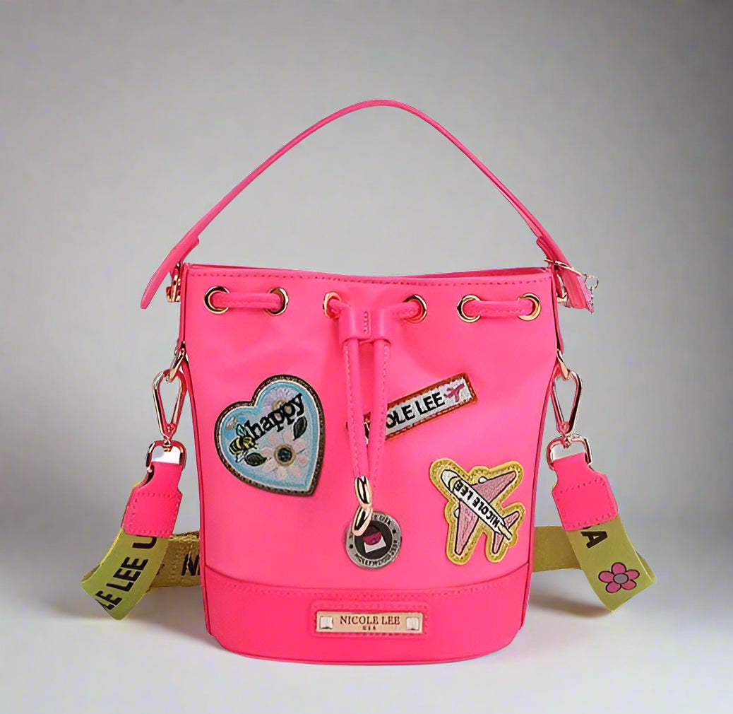 Pink bucket bag with patches on a white background
