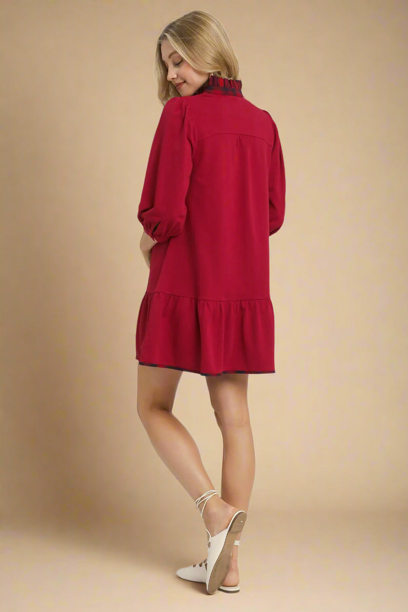 Woman wearing a red dress on a white background